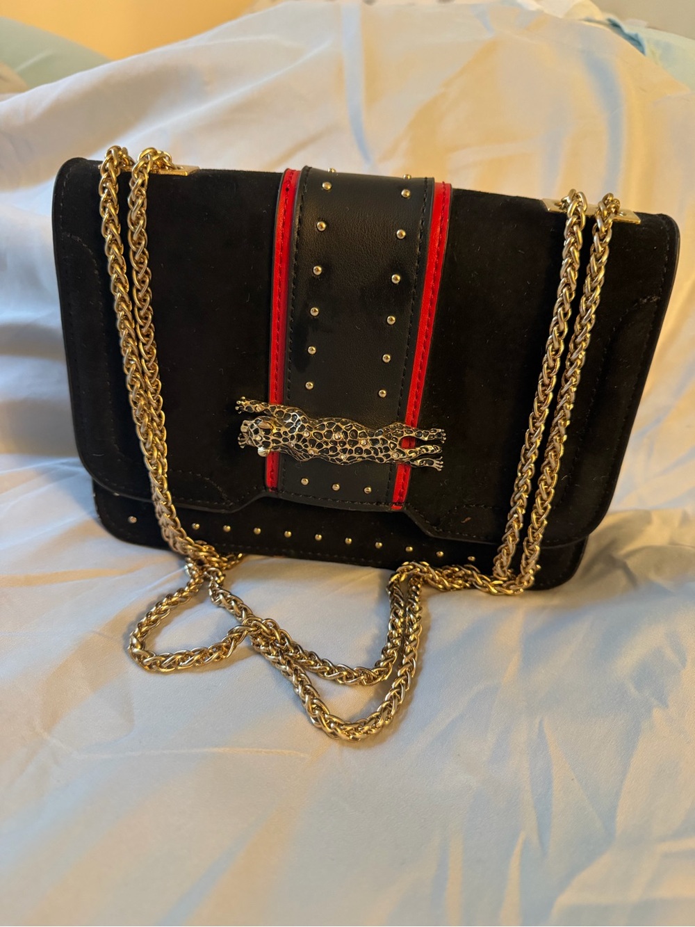 Black Suede Shoulder Bag with Red Trim and Gold Chain